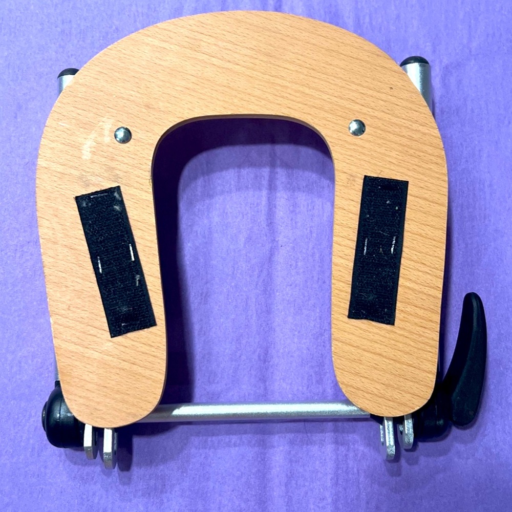Adjustable massage table headrest